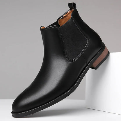 Men's black pointed toe Chelsea boots with a decorative sewing thread detail on the artificial PU upper.