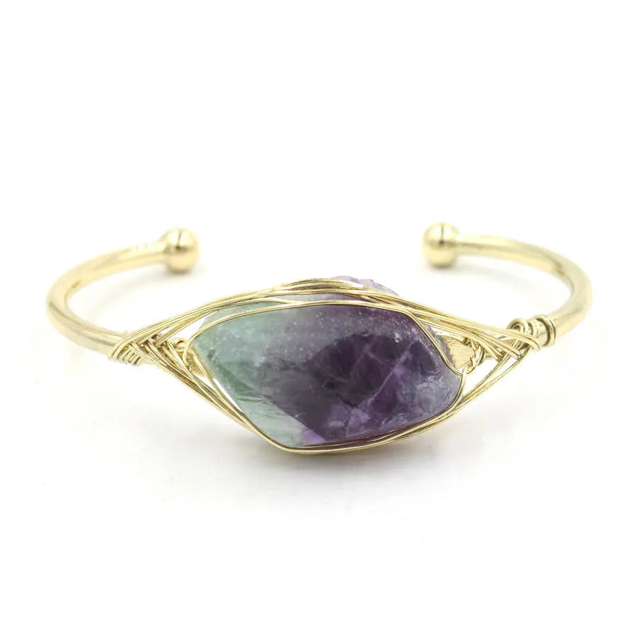 Natural raw gemstone bracelet with 8mm rough crystal beads in ethnic style, shown on wrist.