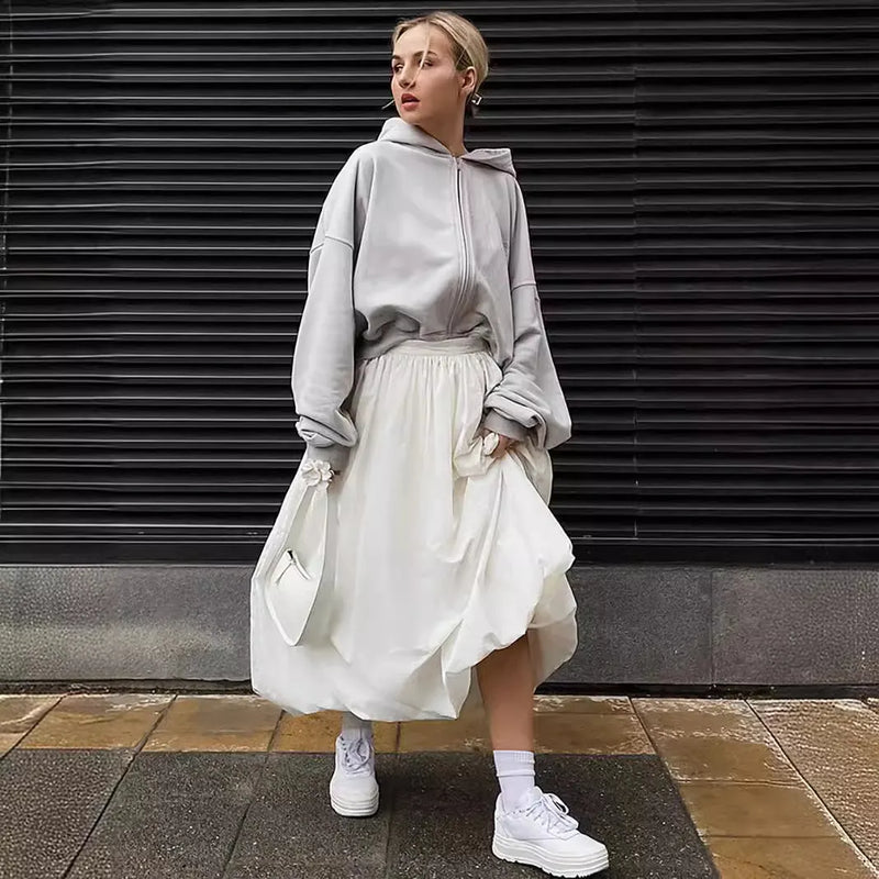 Women's cotton long skirt solid colour inelastic A-line temperament commute style skirt available in black or white in sizes S M L Asian sizing guide provided