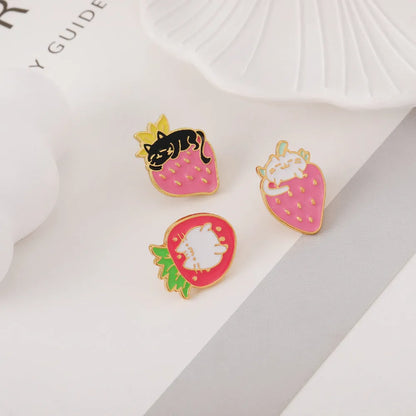 Close-up of a cute cat strawberry and dripping cake oil design metal alloy brooch pin.