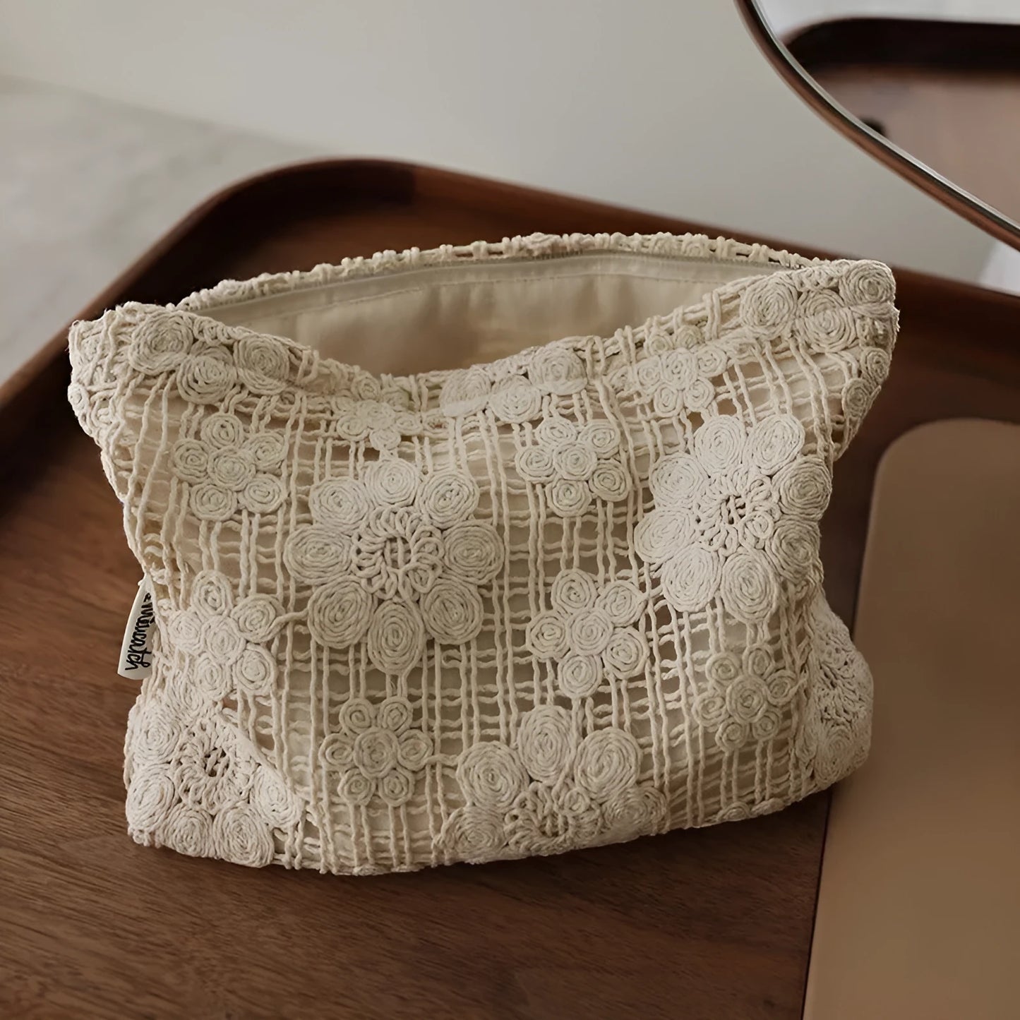 Handmade crocheted corduroy cosmetic bag with hollow flower embroidery in a rope style