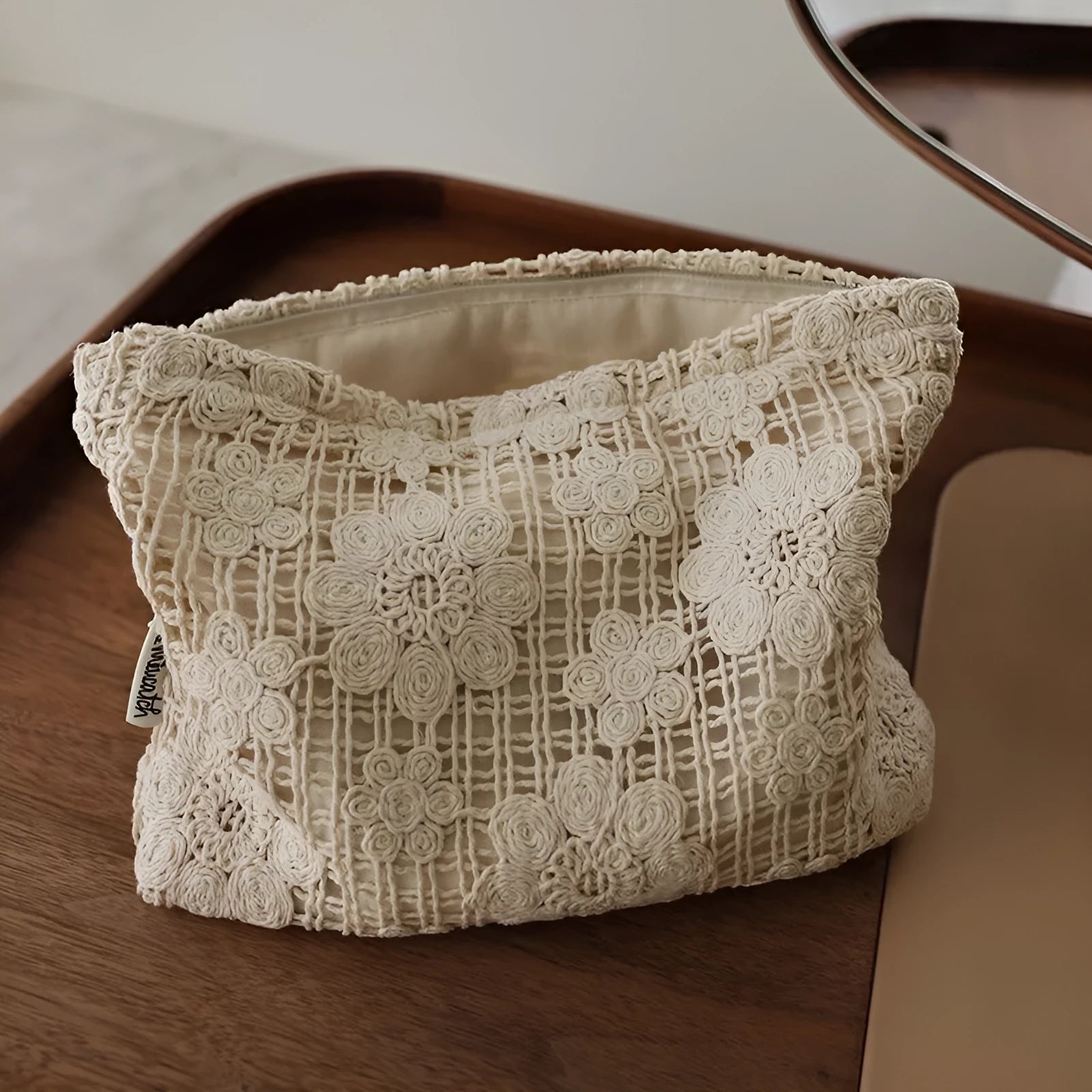 Handmade crocheted corduroy cosmetic bag with hollow flower embroidery in a rope style