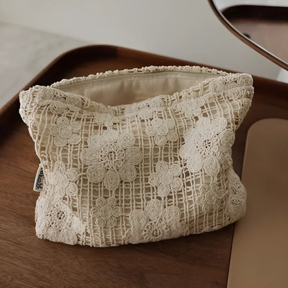Handmade crocheted corduroy cosmetic bag with hollow flower embroidery in a rope style