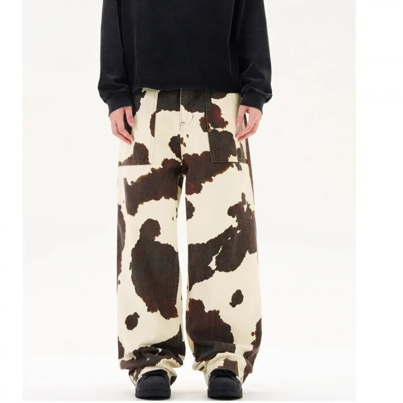 Men's straight-leg trousers with a brown and white cow pattern print.