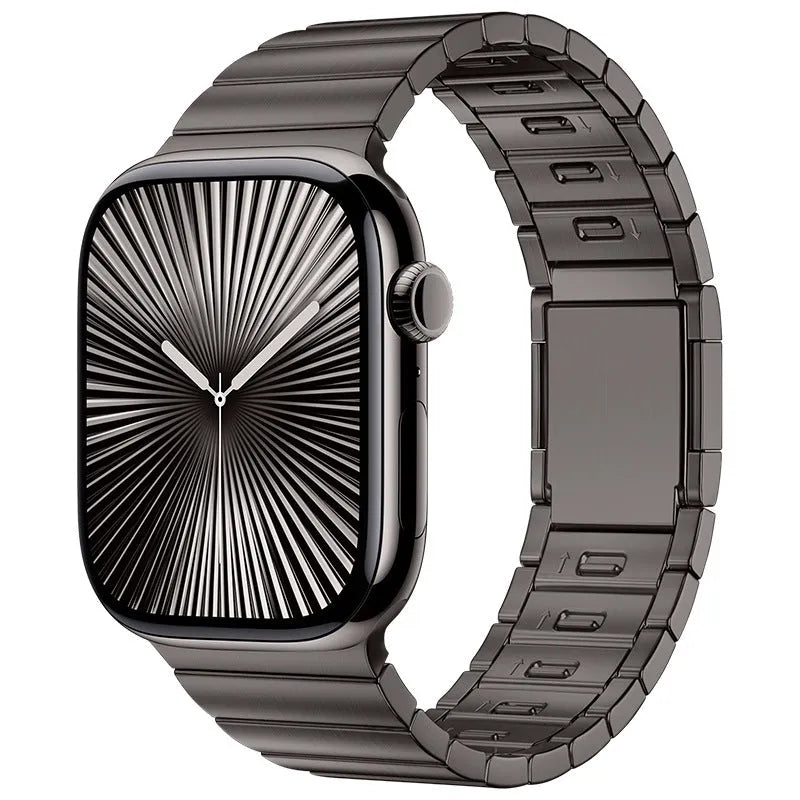 Silver stainless steel magnetic buckle strap attached to an Apple Watch on a wrist.