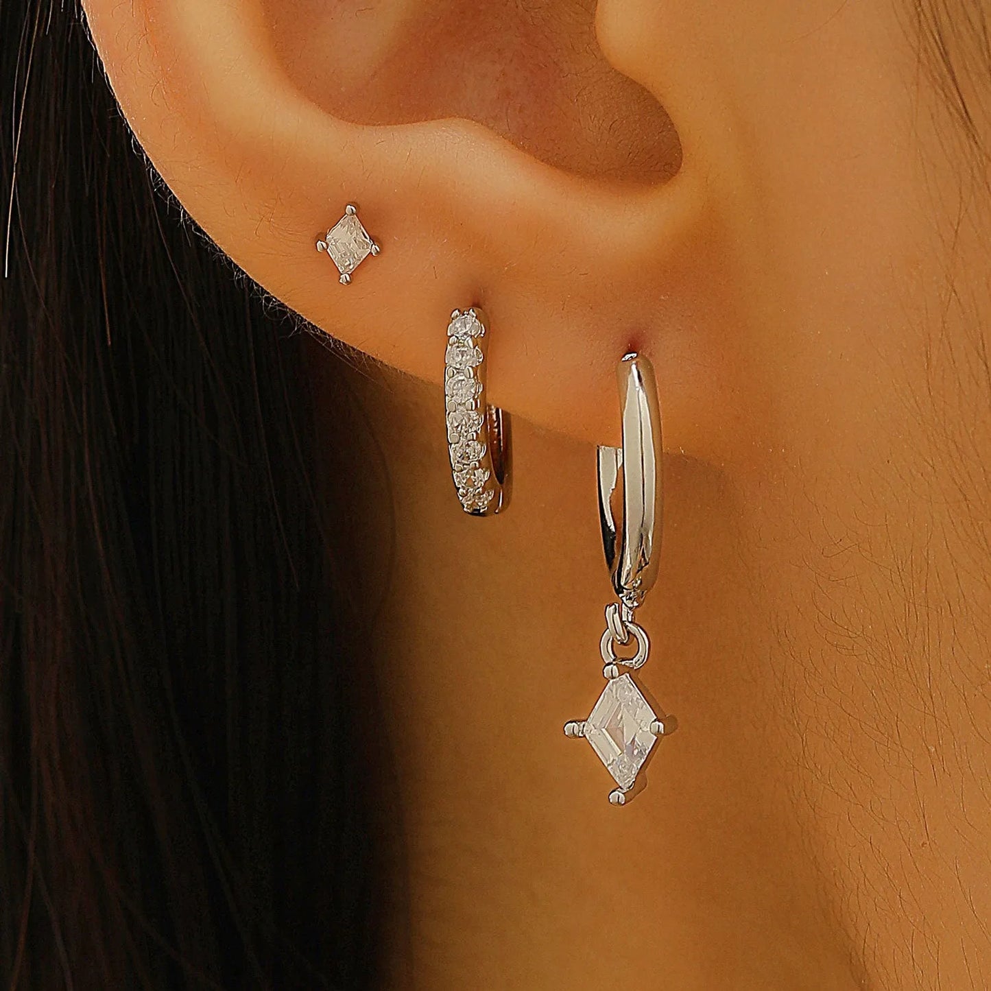 Geometric zircon earring three-piece set for ladies in gold and silver tones.