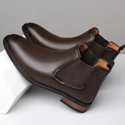 Men's black pointed toe Chelsea boots with a decorative sewing thread detail on the artificial PU upper.
