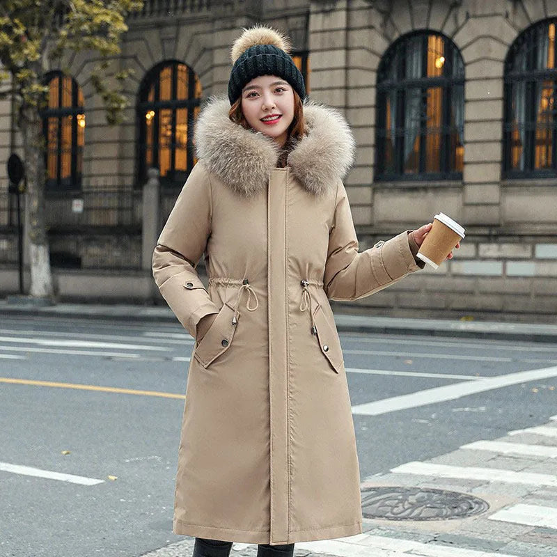 Long white women's fleece trench coat with down cotton padding on a hanger.