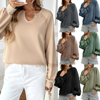 Women's loose fit long sleeve sweater with half-open collar and lace stitching detail in solid colour.