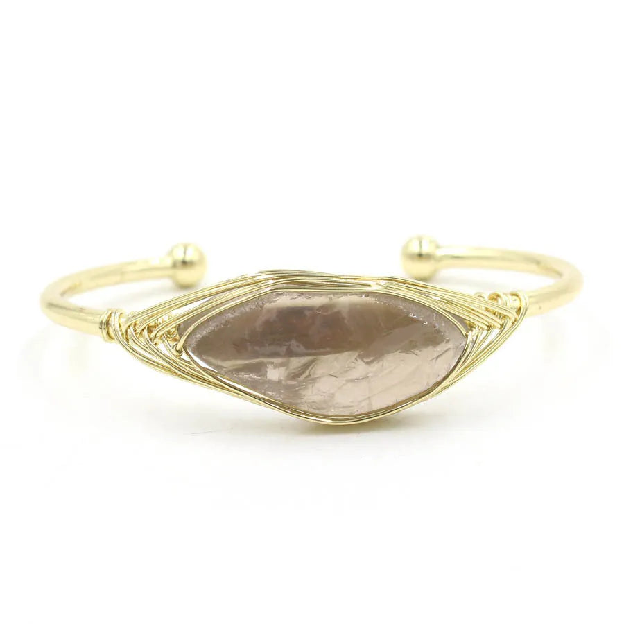 Natural raw gemstone bracelet with 8mm rough crystal beads in ethnic style, shown on wrist.