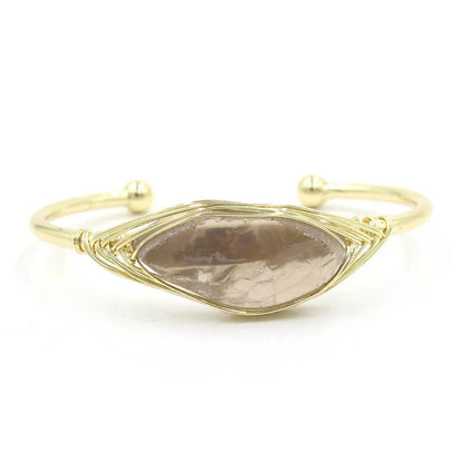 Natural raw gemstone bracelet with 8mm rough crystal beads in ethnic style, shown on wrist.