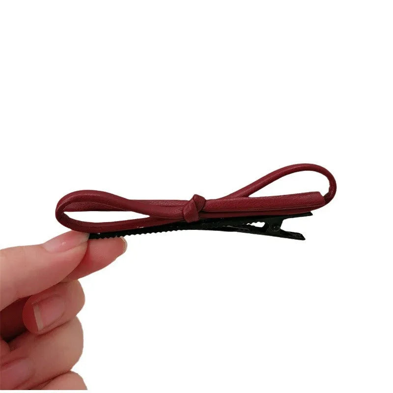 Wine red leather bow hair barrette with 2.5cm bow width and 5cm clip length