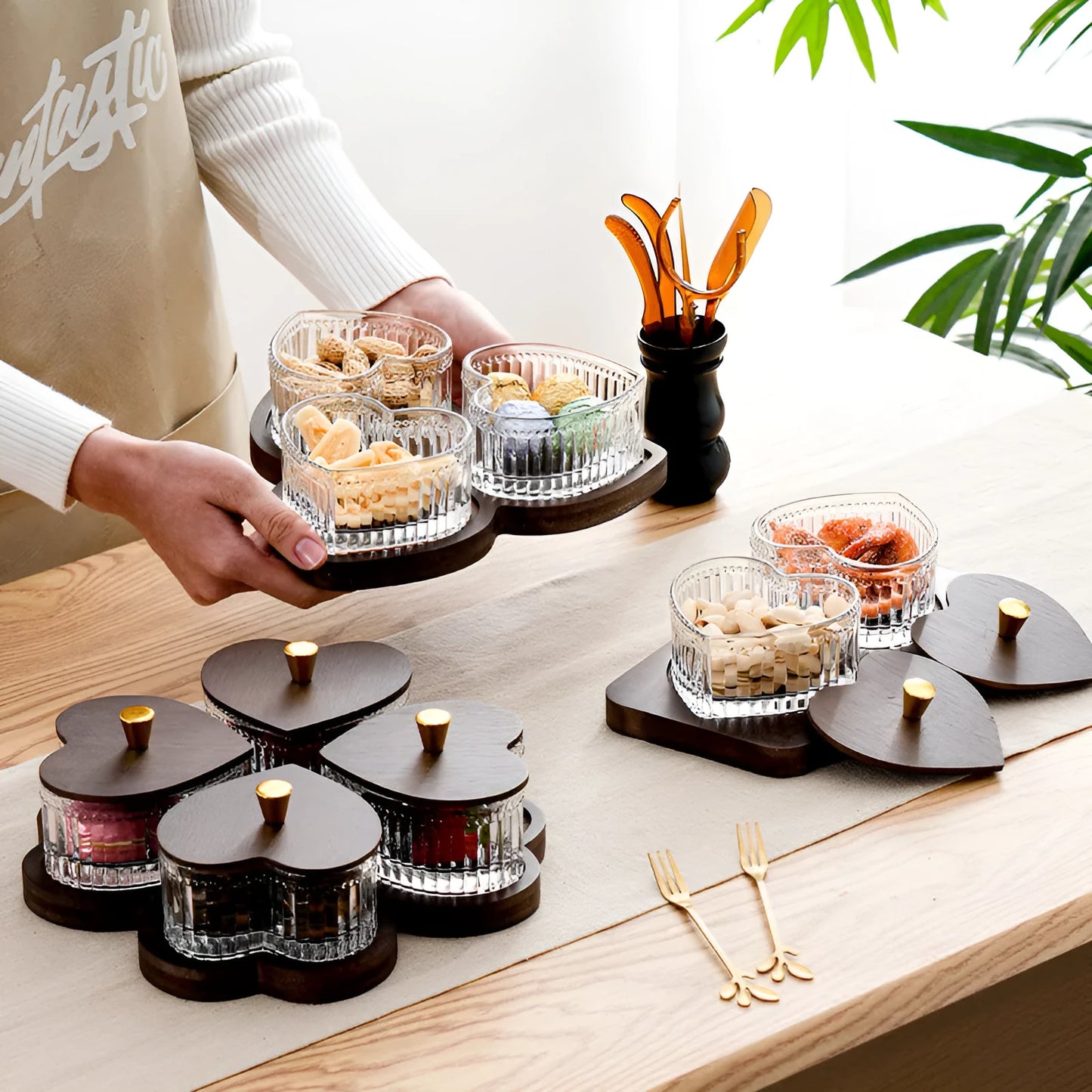 Glass dim sum fruit platter with coloured glaze and a transparent heart-shaped lid on a multi-grid tray.