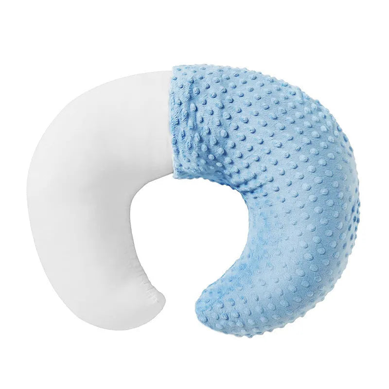 Nursing pillow with integrated 15cm raised barrier to prevent milk spills during breastfeeding, shown with removable pillowcase