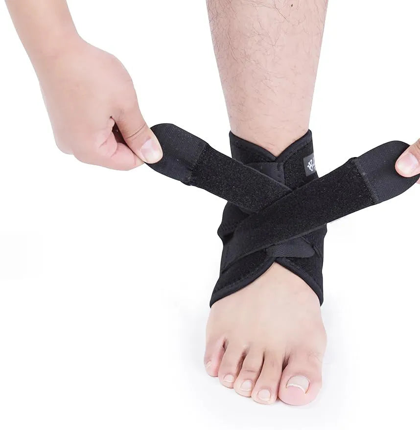 A single black sports ankle support laid flat, designed for injury protection during various athletic activities.