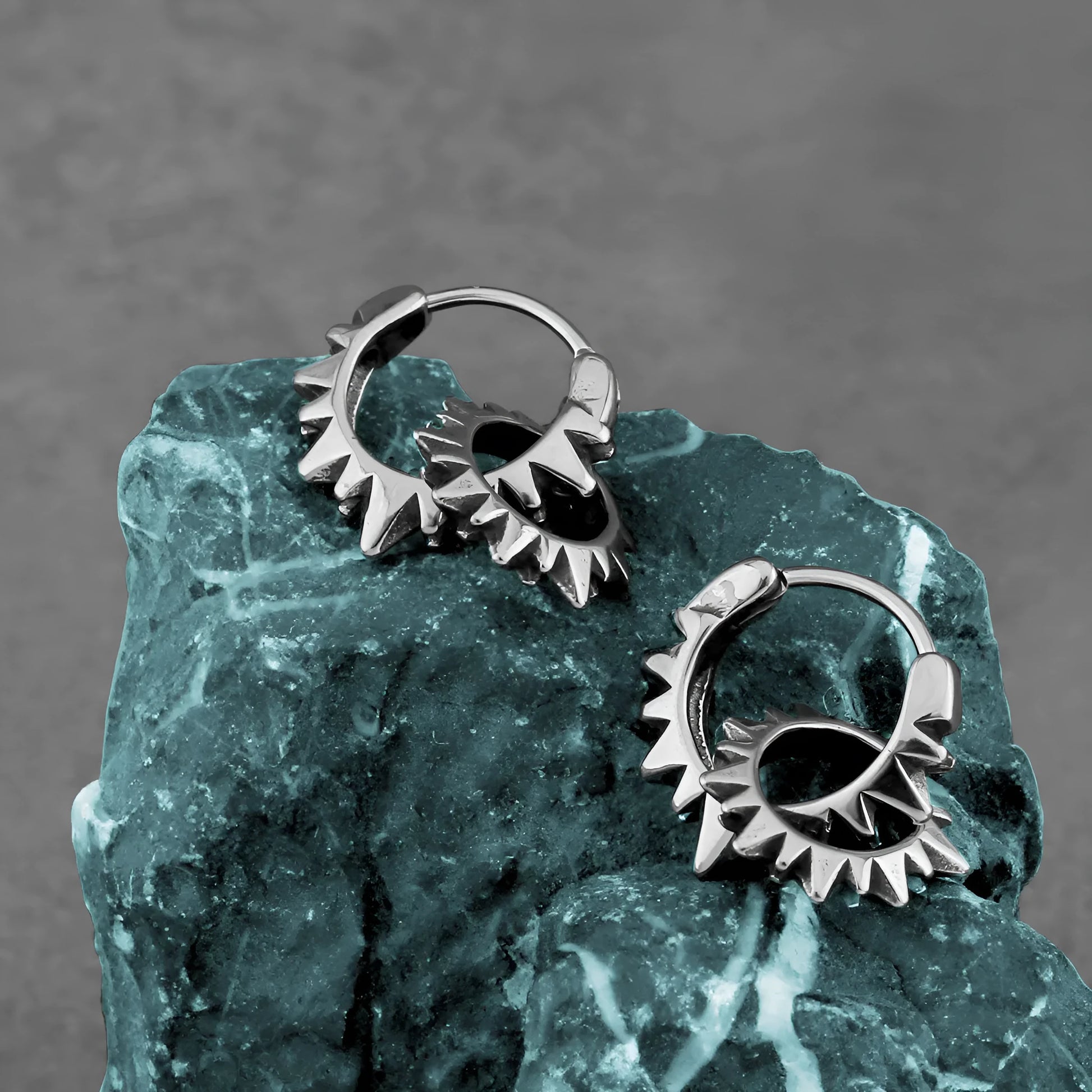 Simple round stainless steel hoop earrings with a polished finish, shown on a plain background.