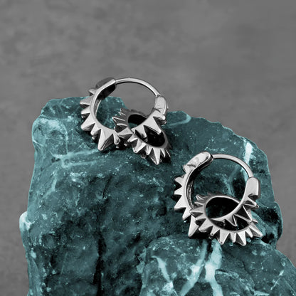 Simple round stainless steel hoop earrings with a polished finish, shown on a plain background.