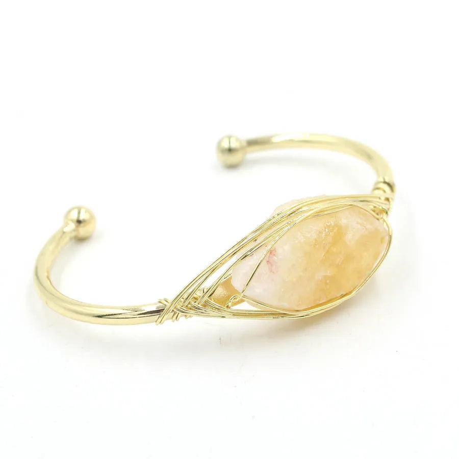 Natural raw gemstone bracelet with 8mm rough crystal beads in ethnic style, shown on wrist.