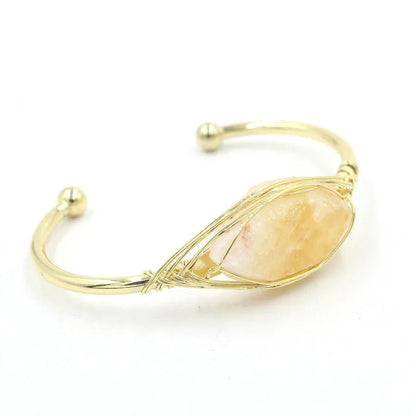 Natural raw gemstone bracelet with 8mm rough crystal beads in ethnic style, shown on wrist.