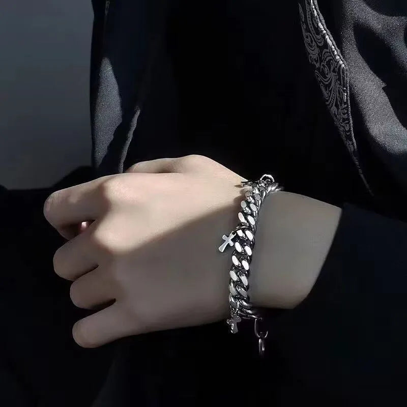 Men's titanium steel bracelet with a geometric cross charm on a black background.