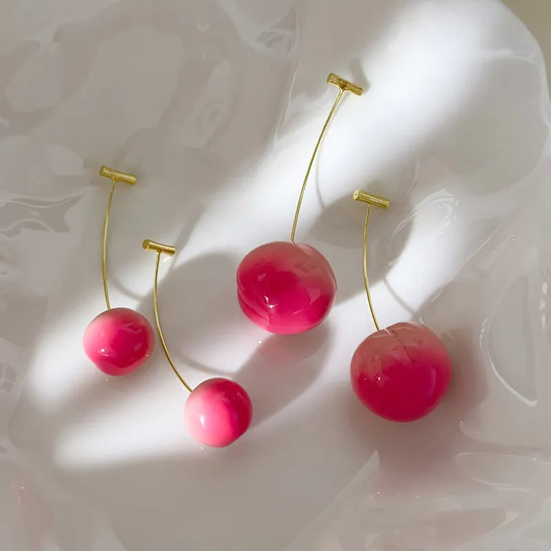 Acrylic peach-shaped earrings with copper posts in small and large size options