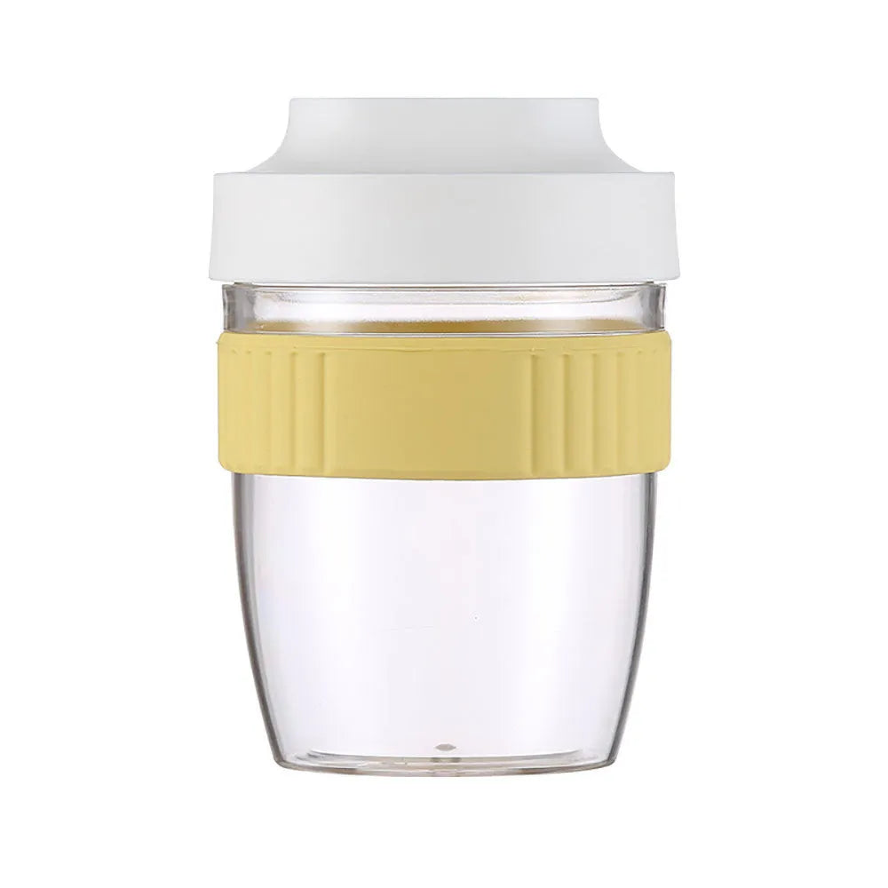 Green PP plastic salad cup with attached lid and spoon on a white background.