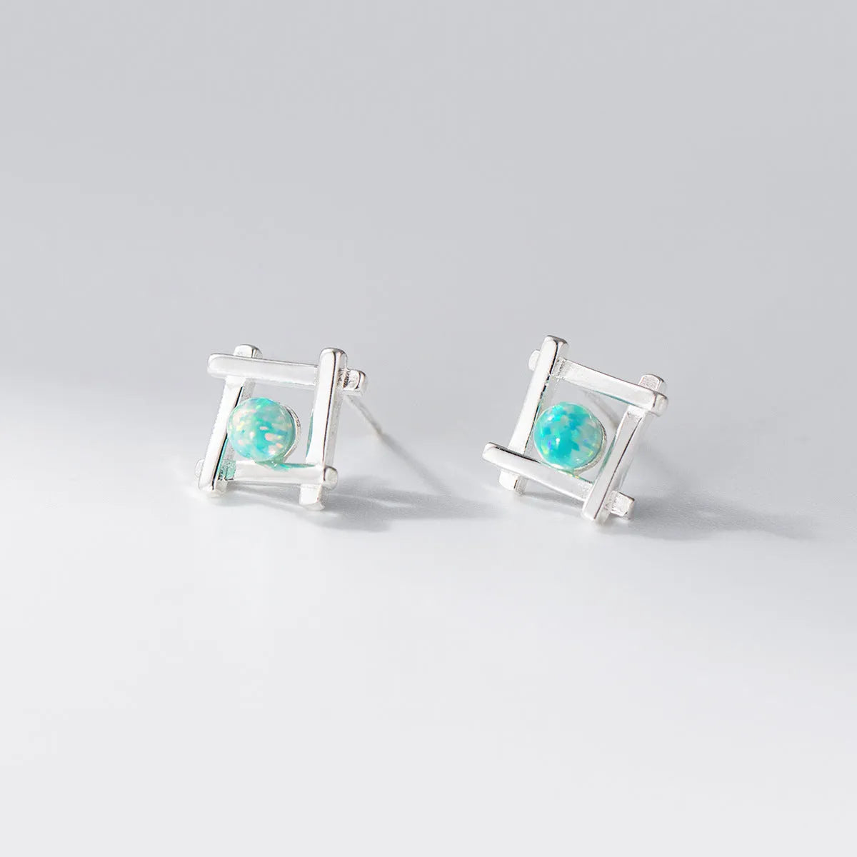 Geometric cross quadrangle stud earrings in S925 silver with silver or gold plating options