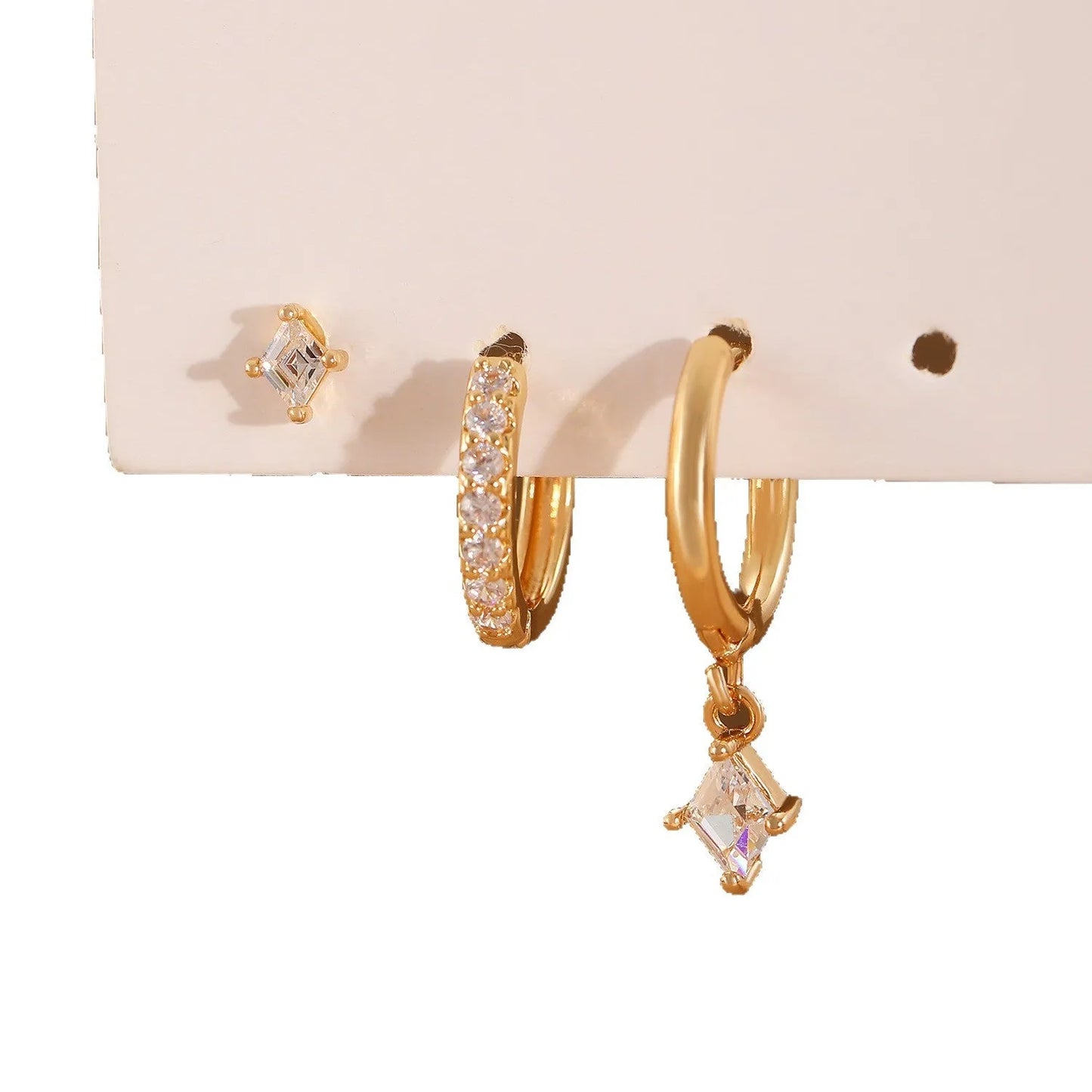 Geometric zircon earring three-piece set for ladies in gold and silver tones.