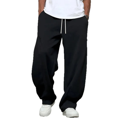 Men's solid colour casual trousers with a straight leg and elastic drawstring waist.