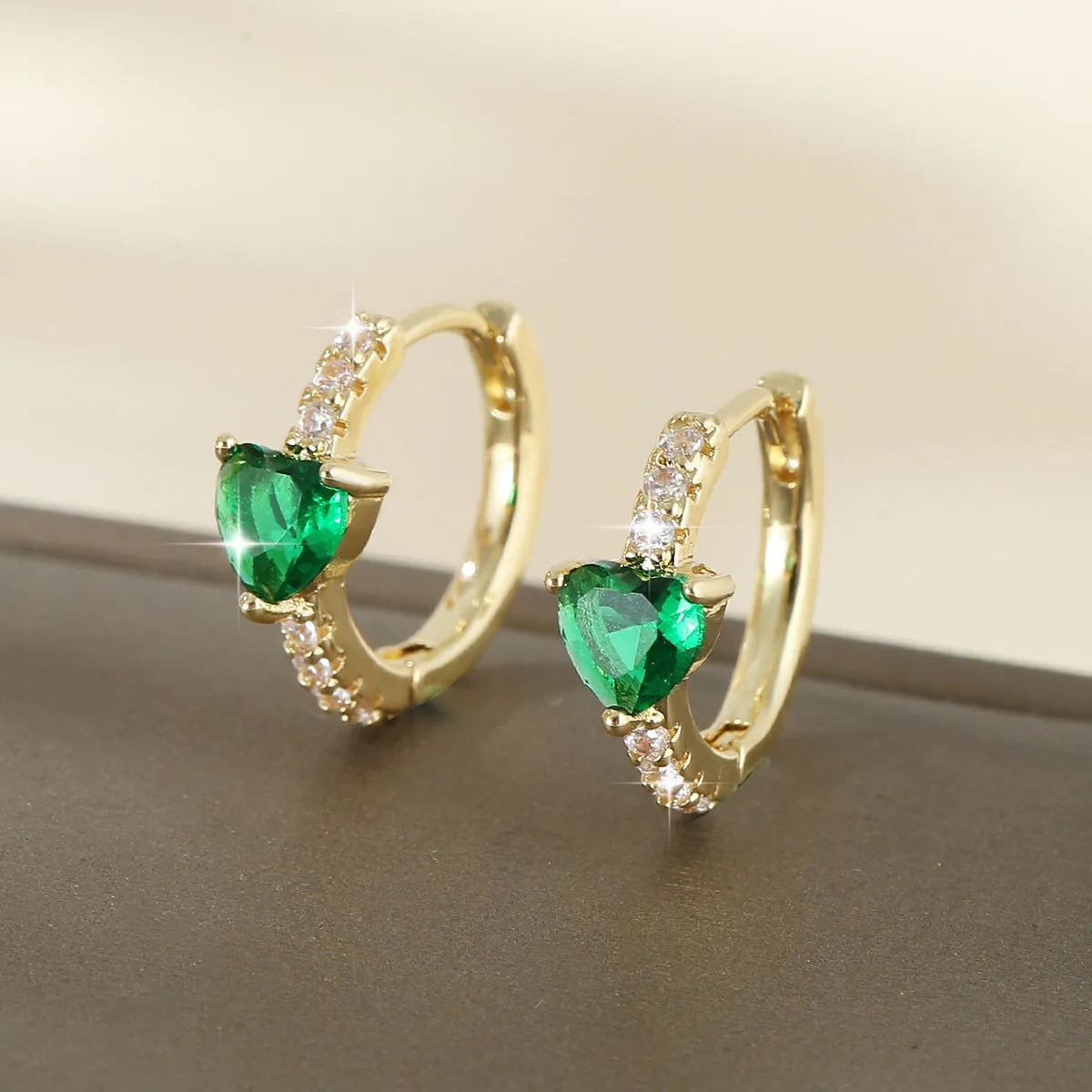 Round love heart copper clip-on earrings in pink, white, and green with geometric design