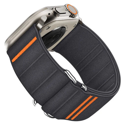 Elastic nylon Apple Watch band in Army Green with stainless steel buckle, shown on a wrist.