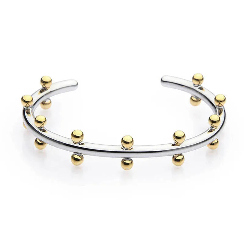 C-shaped stainless steel bracelet with textured rivets and bean beads in gold finish