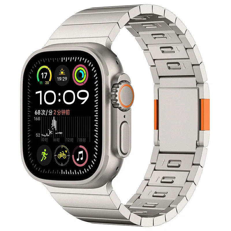 Silver stainless steel magnetic buckle strap attached to an Apple Watch on a wrist.