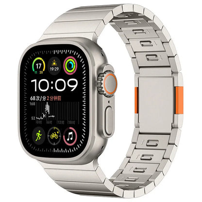 Silver stainless steel magnetic buckle strap attached to an Apple Watch on a wrist.