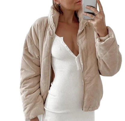 Apricot women's corduroy jacket with stand collar and front zip on a hanger.