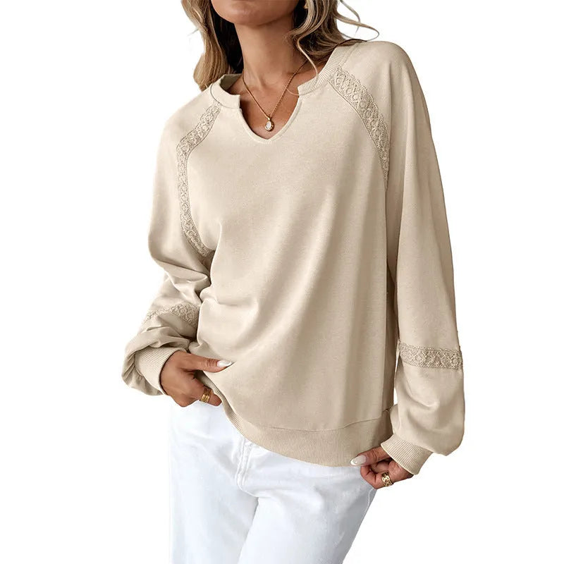 Women's loose fit long sleeve sweater with half-open collar and lace stitching detail in solid colour.