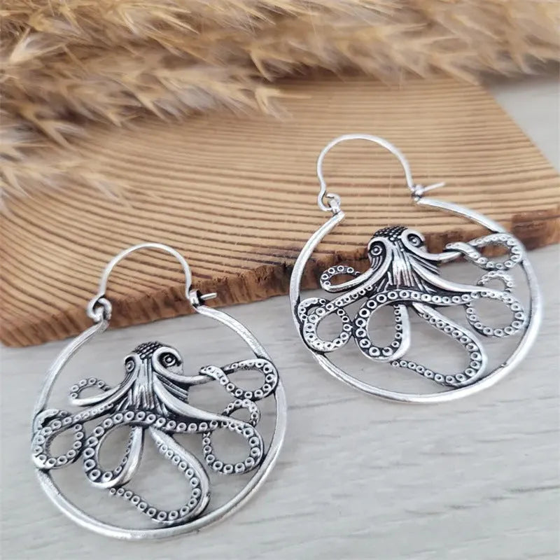 Close-up of vintage-style octopus earrings in antique silver colour with zinc alloy construction.