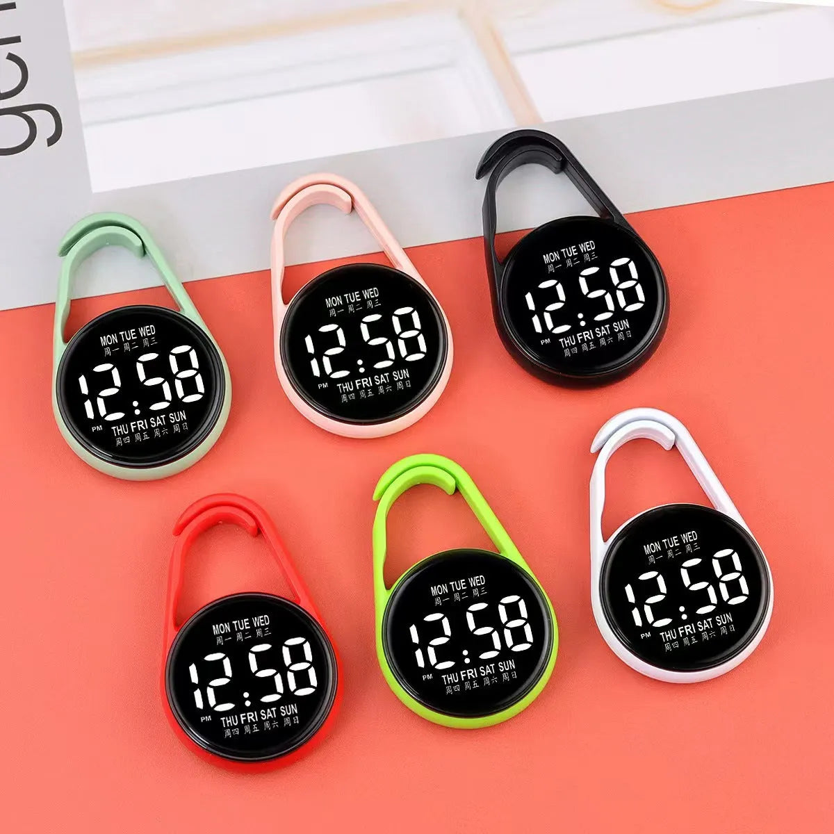 Mini digital LED electronic watch with plastic strap in various colours like fluorescent green and black on display.