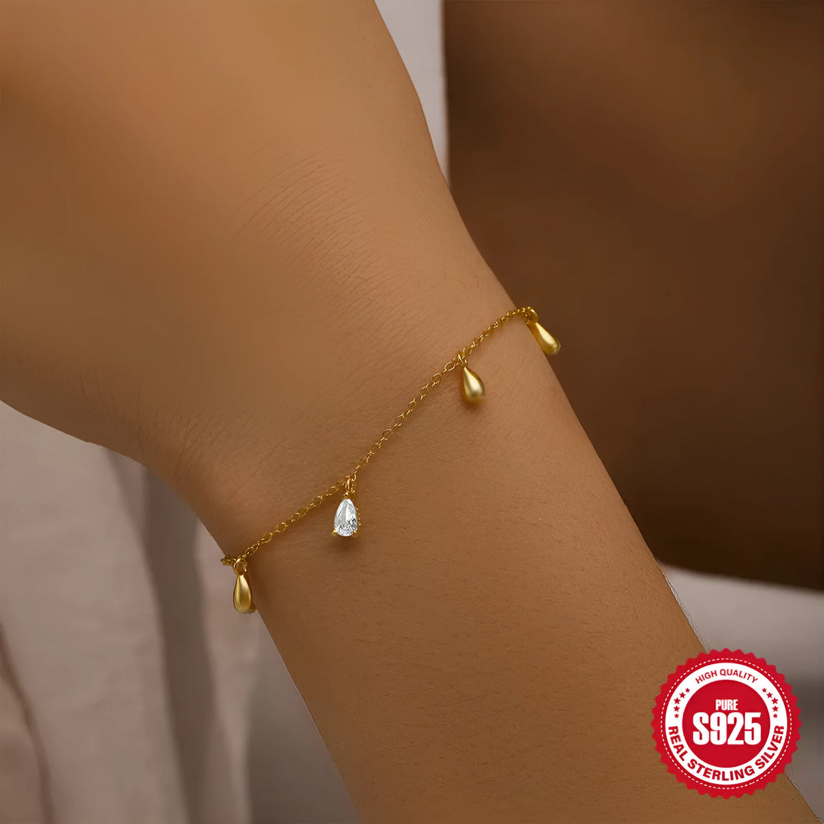 Gold coloured S925 sterling silver women's bracelet with water drop diamond pendant