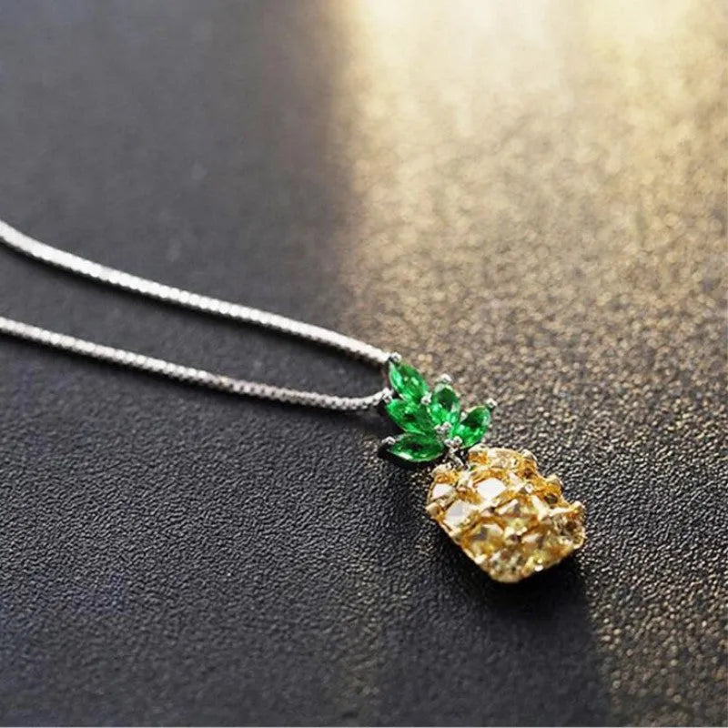 Geometric pineapple pendant necklace with silver and copper white gold plated finish on model