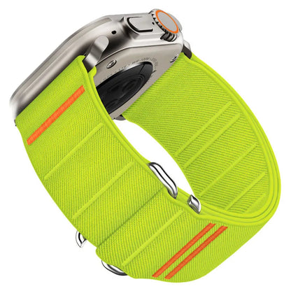 Elastic nylon Apple Watch band in Army Green with stainless steel buckle, shown on a wrist.