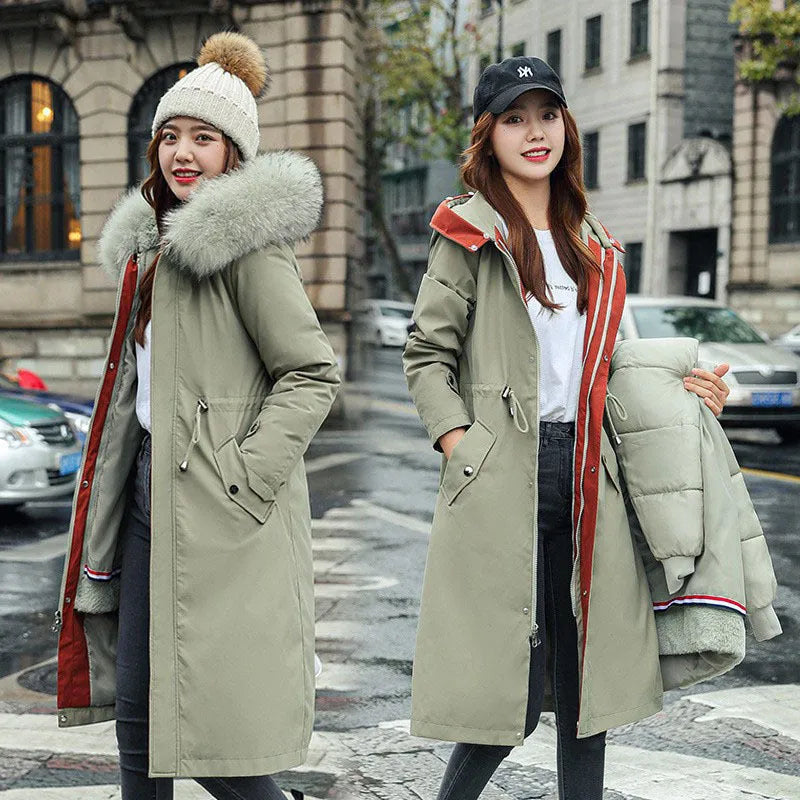 Long white women's fleece trench coat with down cotton padding on a hanger.