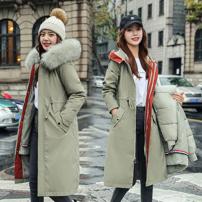 Long white women's fleece trench coat with down cotton padding on a hanger.