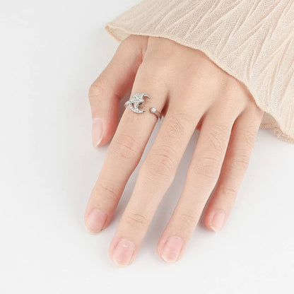 Adjustable copper ring with micro-inlaid zircon stars and rotating moon element in geometric design
