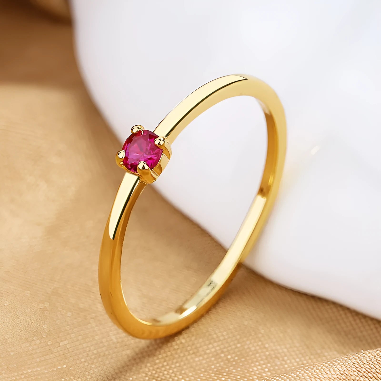 Twin Style copper geometric circle ring with a single diamond, shown in blue, green, red, or white.
