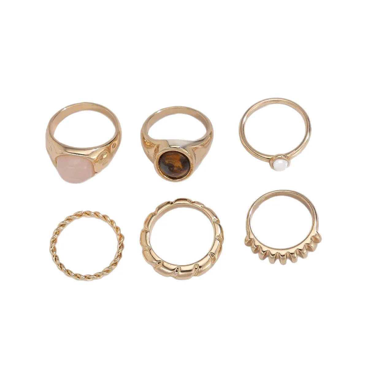 Six irregular geometric alloy rings with light gold electroplated finish arranged as a jewellery set