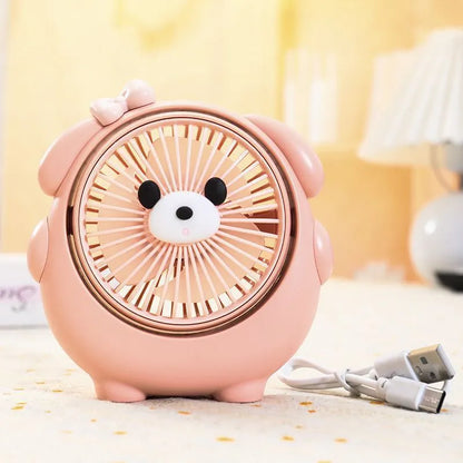 USB desktop fan with dog design showing three speed buttons and USB port, placed on a desk.