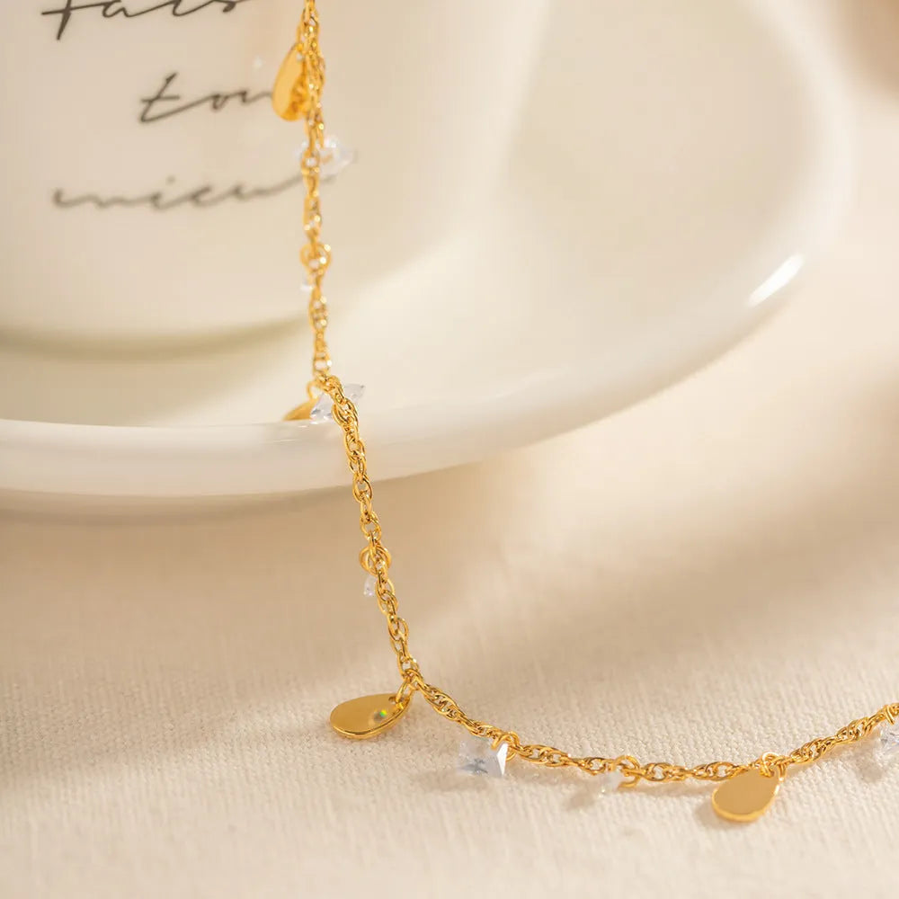 Stainless steel water drop tassel anklet with geometric shapes and adjustable chain