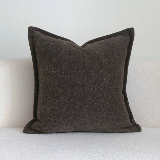 Coffee brown mid-century modern pillow sofa with brushed fabric cover and PP cotton filler on a living room sofa