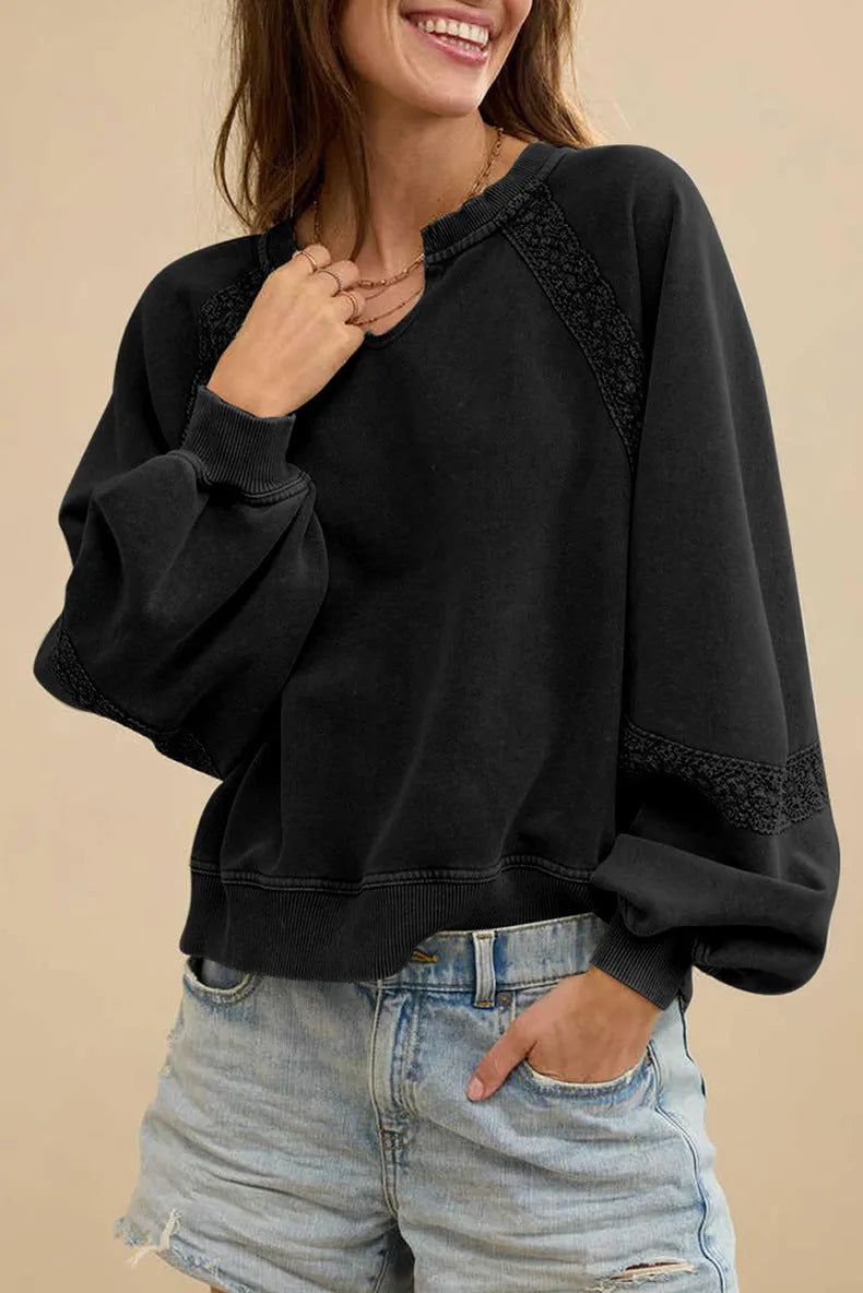 Women's loose fit long sleeve sweater with half-open collar and lace stitching detail in solid colour.